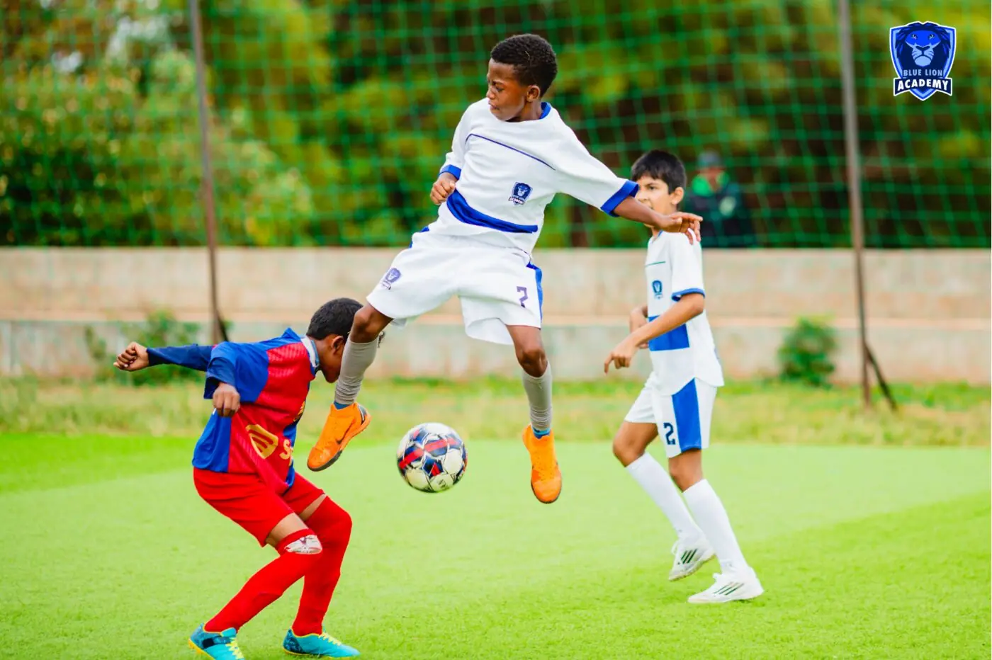 Scholarship athletes experience structured Blue Lion Football Academy competition.