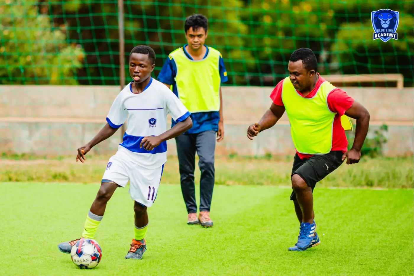 Children train and compete alongside players from different backgrounds.